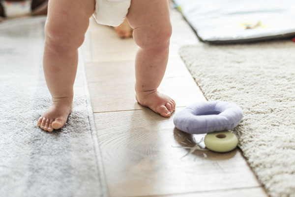 Closeup of baby's legs while standing, Photo credit rawpixel