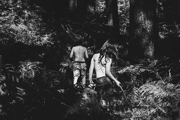 Kids are looking for a secret place in the woods