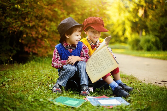 The boys are reading the book