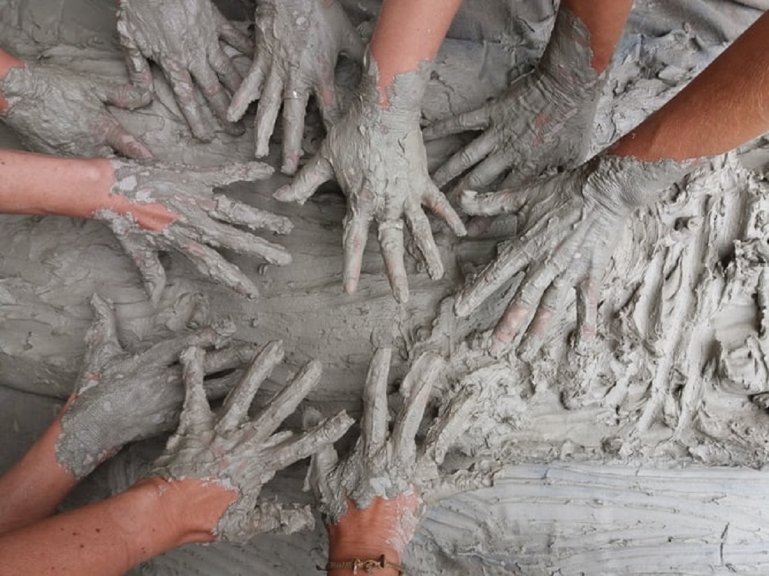 Children with clay makes ceramics bowl