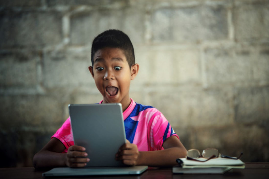 The boy using laptop for learning, photo credir jcomp