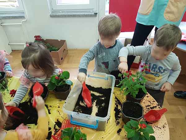 Children plant flowers