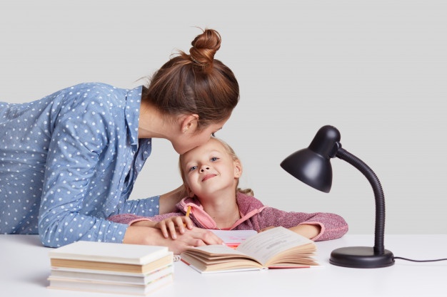 Mother talking with her daughter about school