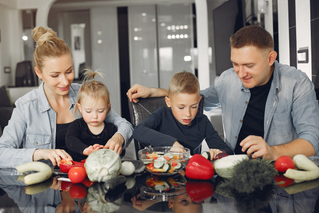 The family prepares dinner