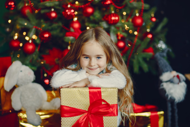 Little girl with christmas presents